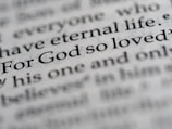 a close up of the word for god so loved written in a dictionary