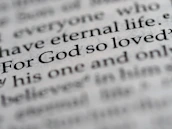 a close up of the word for god so loved written in a dictionary