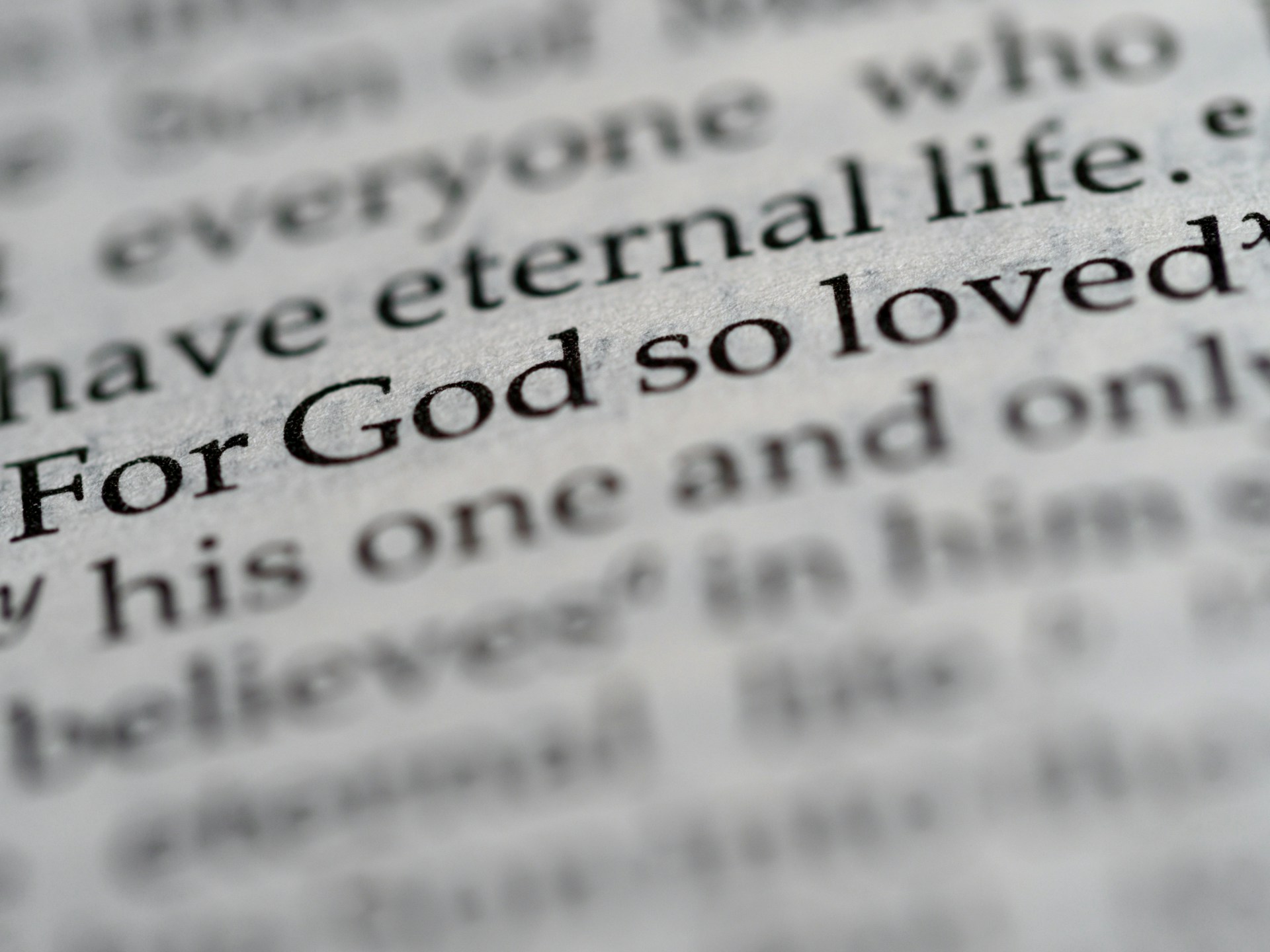 a close up of the word for god so loved written in a dictionary