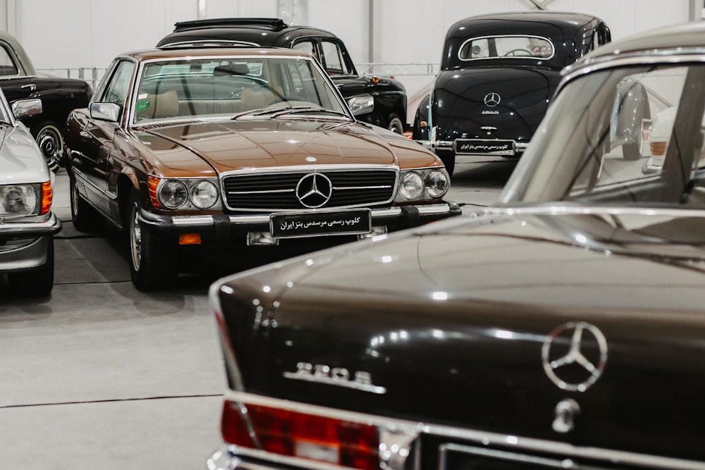 a group of cars parked next to each other in a garage