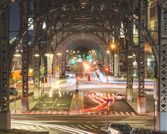 a view of a city street at night from a bridge