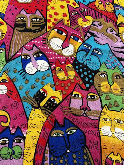 A colorful drawing of playful cartoon kittens on children's clothing.