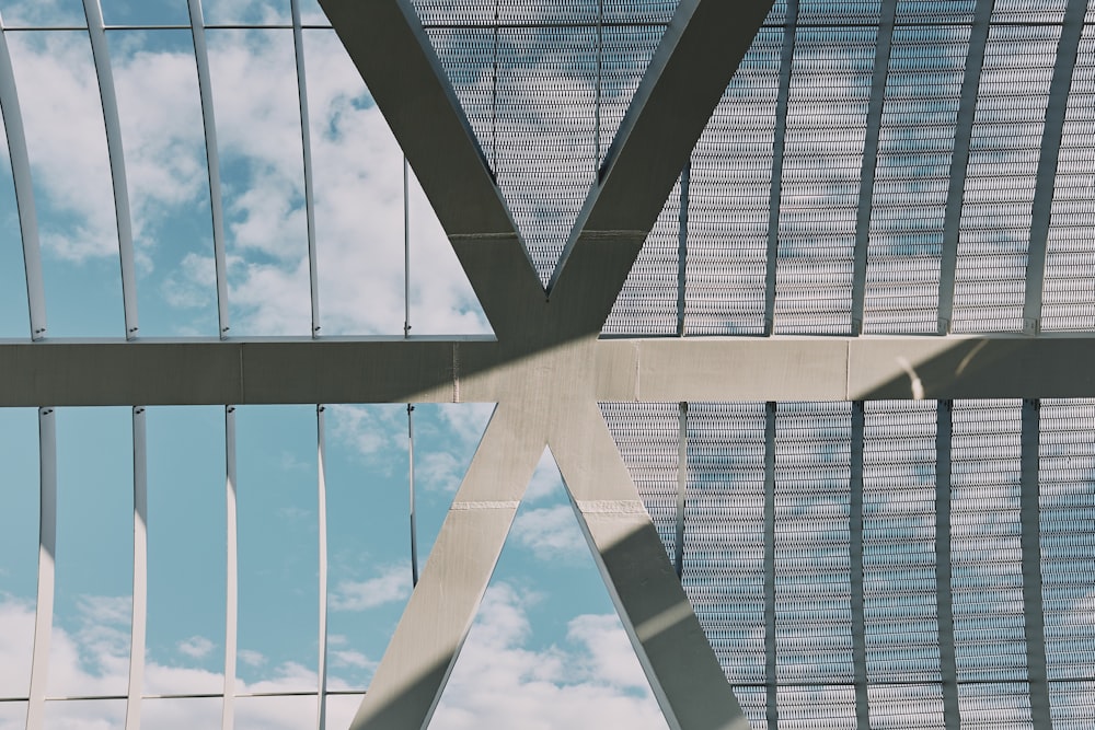 a view of the ceiling of a building with a sky in the background