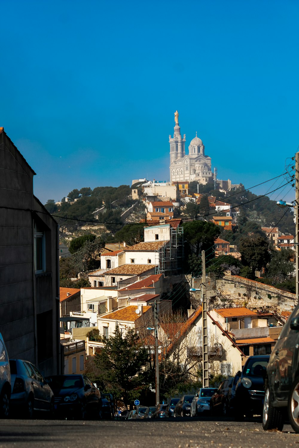 a view of a city with a church on top of a hill