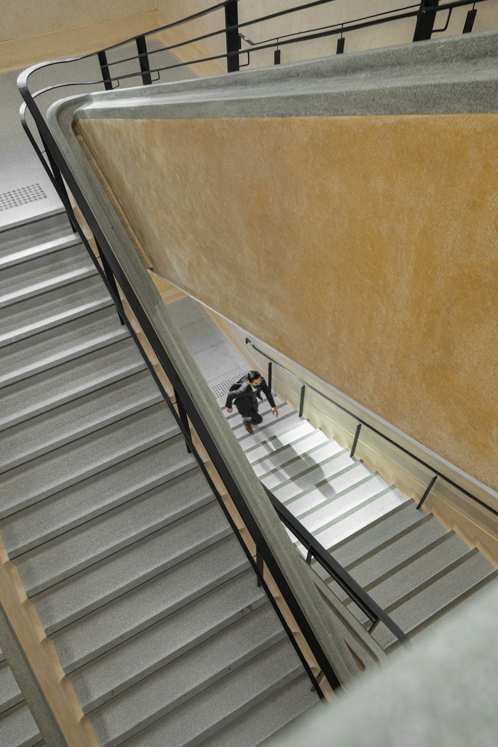 a man riding a skateboard down an escalator