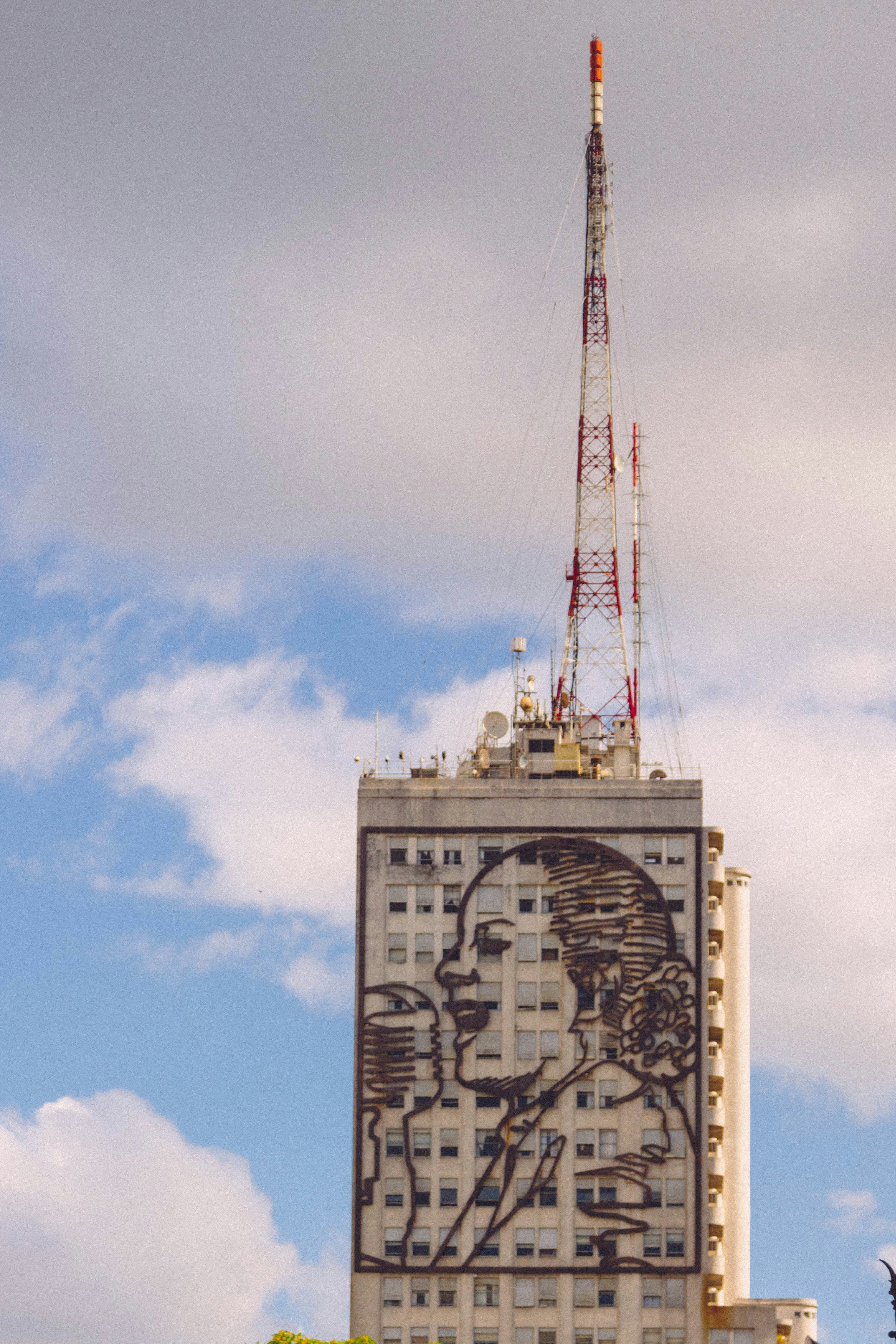a tall building with a painting on the side of it