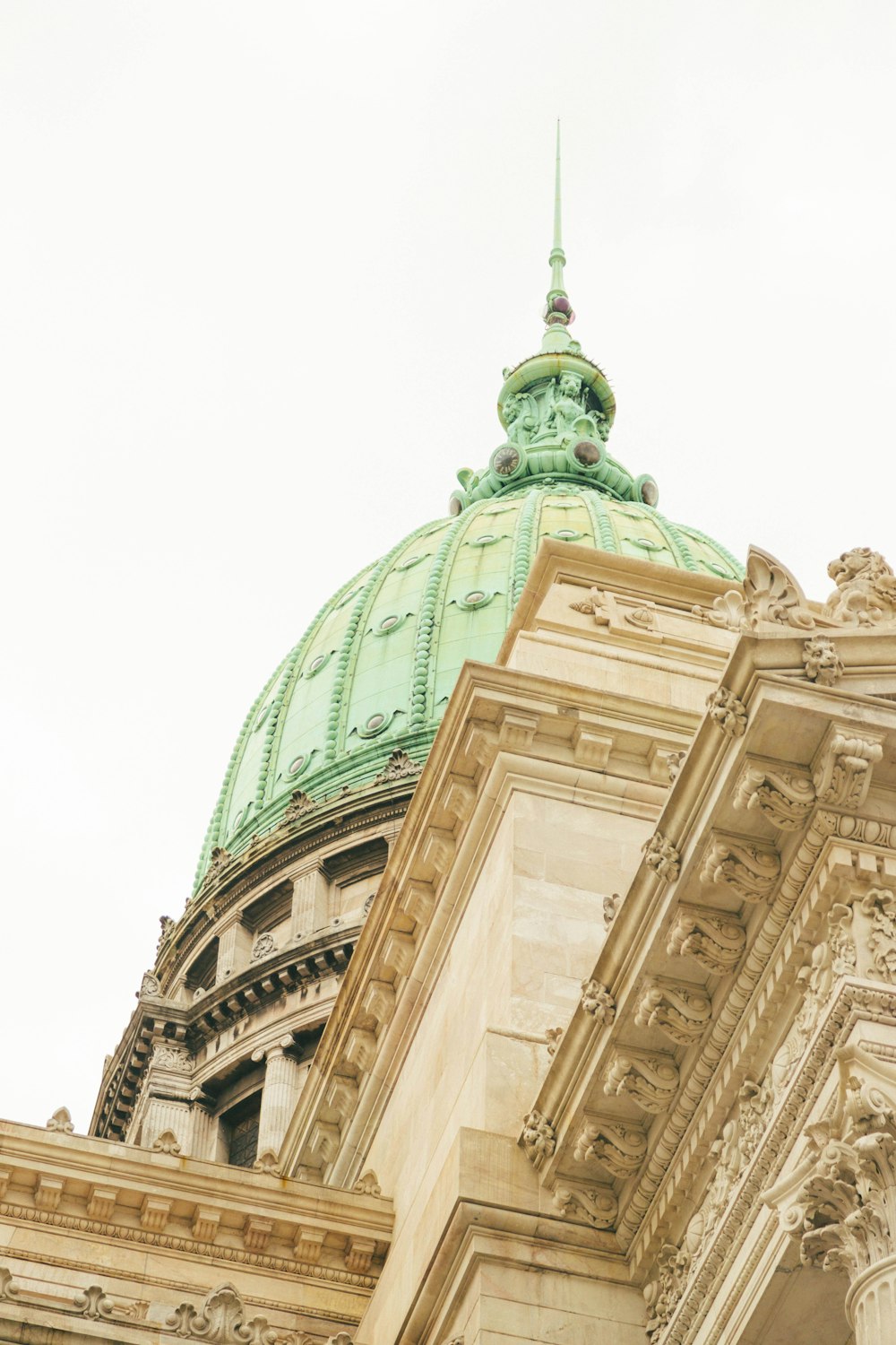 a large building with a green dome on top