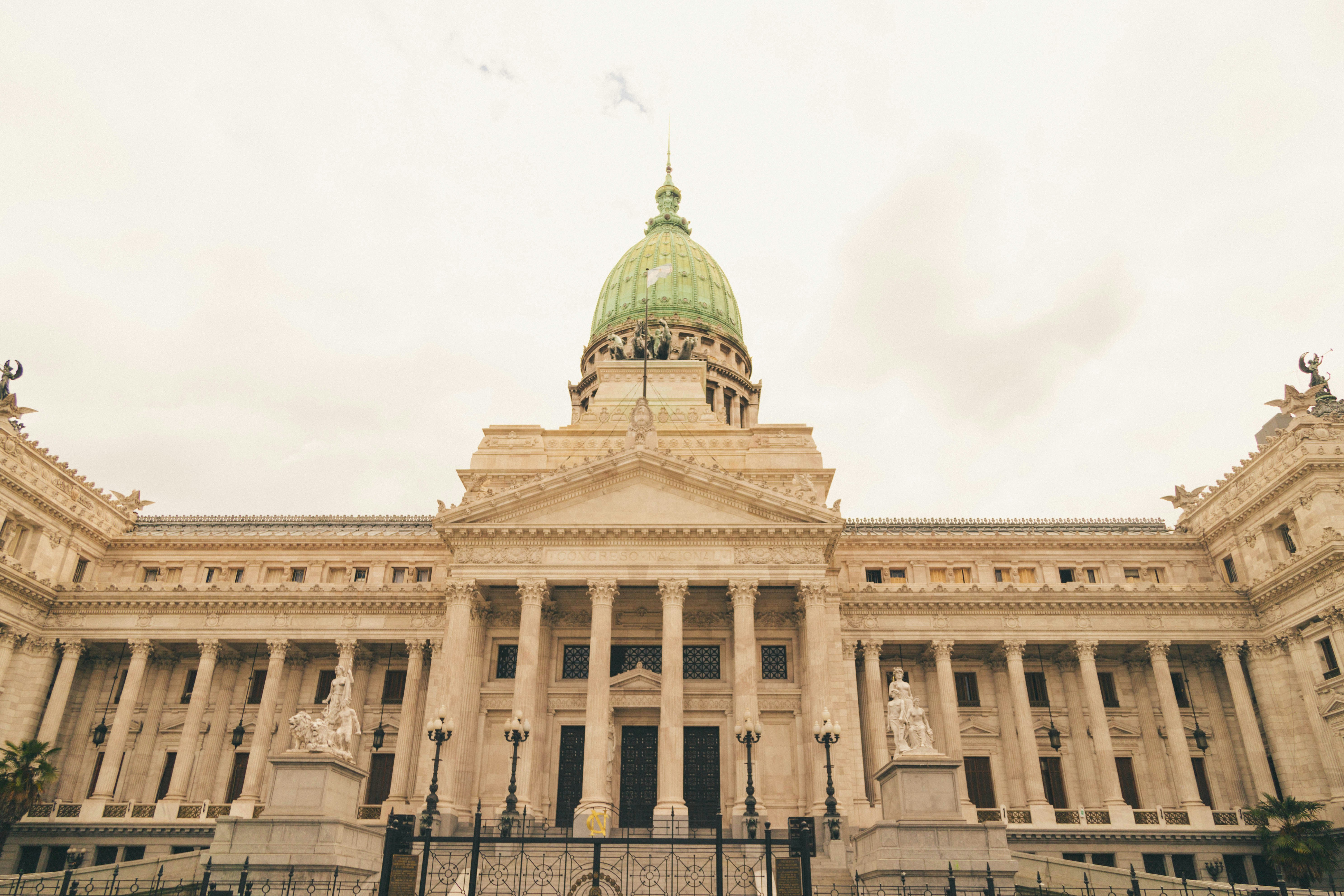 a large building with a green dome on top