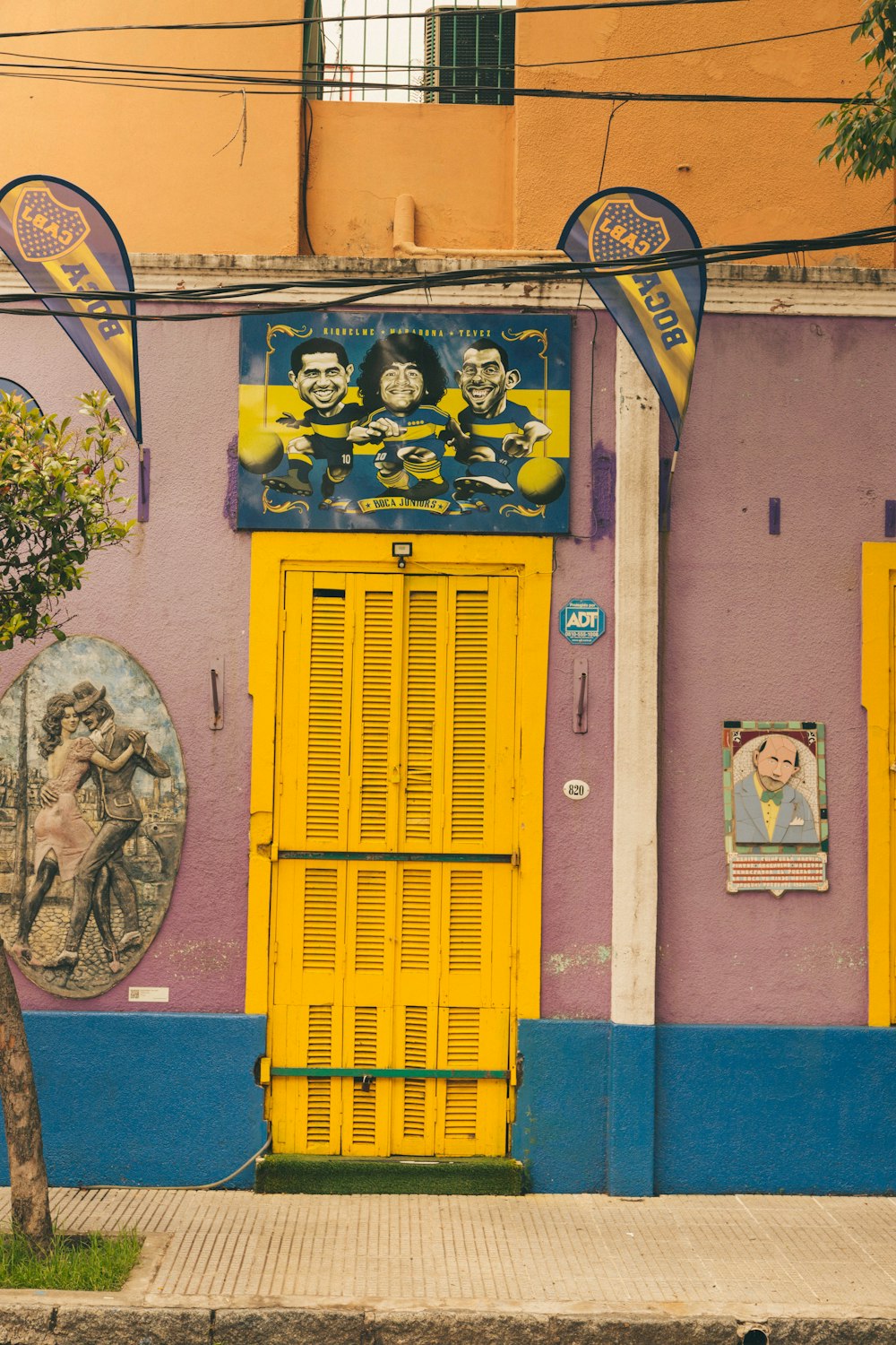 a yellow door on the side of a building