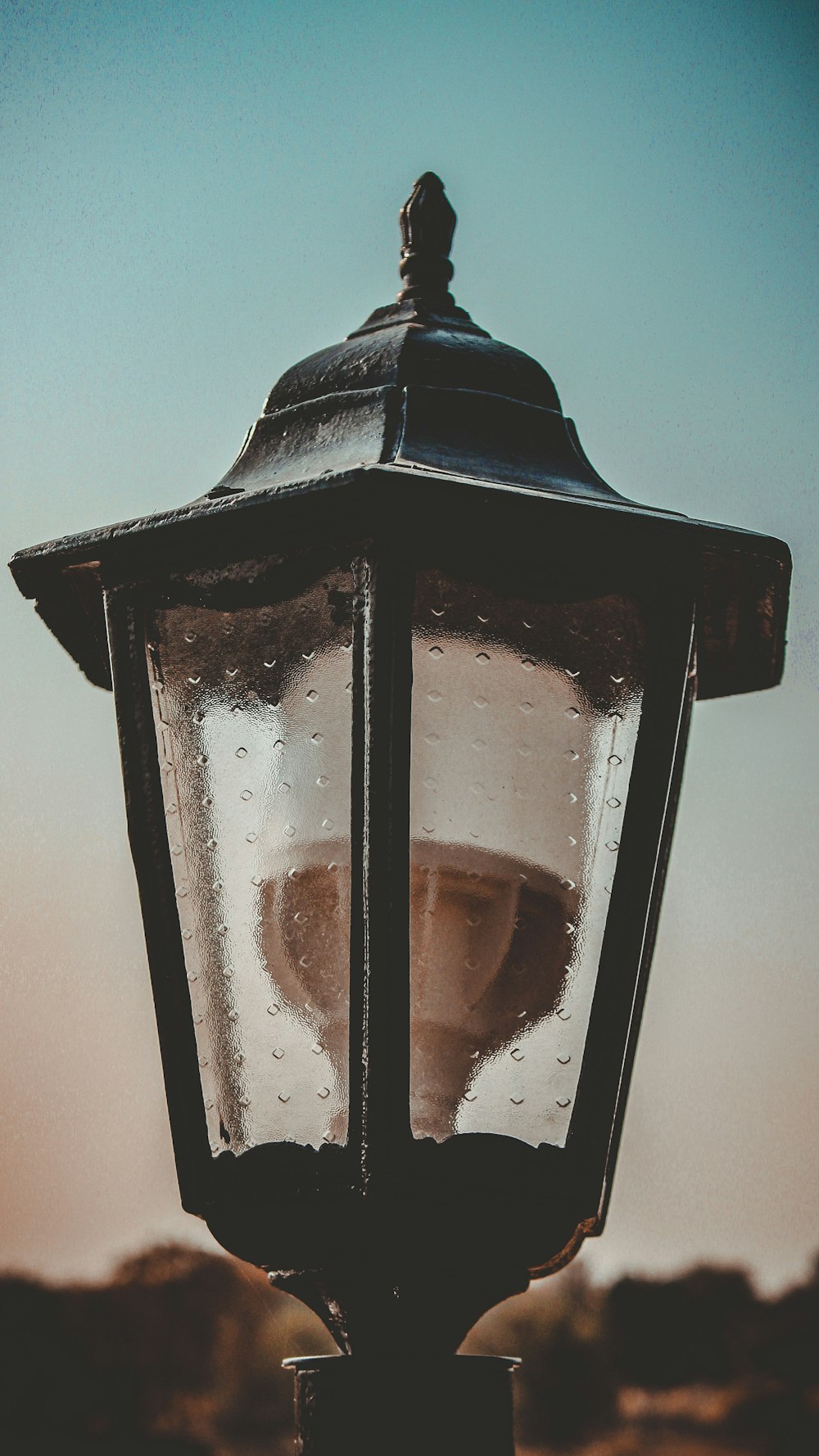 a street light with water droplets on it