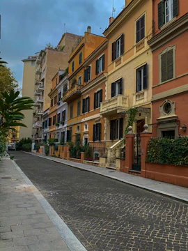 Historic Low Country street lined with colorful homes under a bright sky.