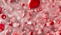 a bunch of red bubbles floating in the air