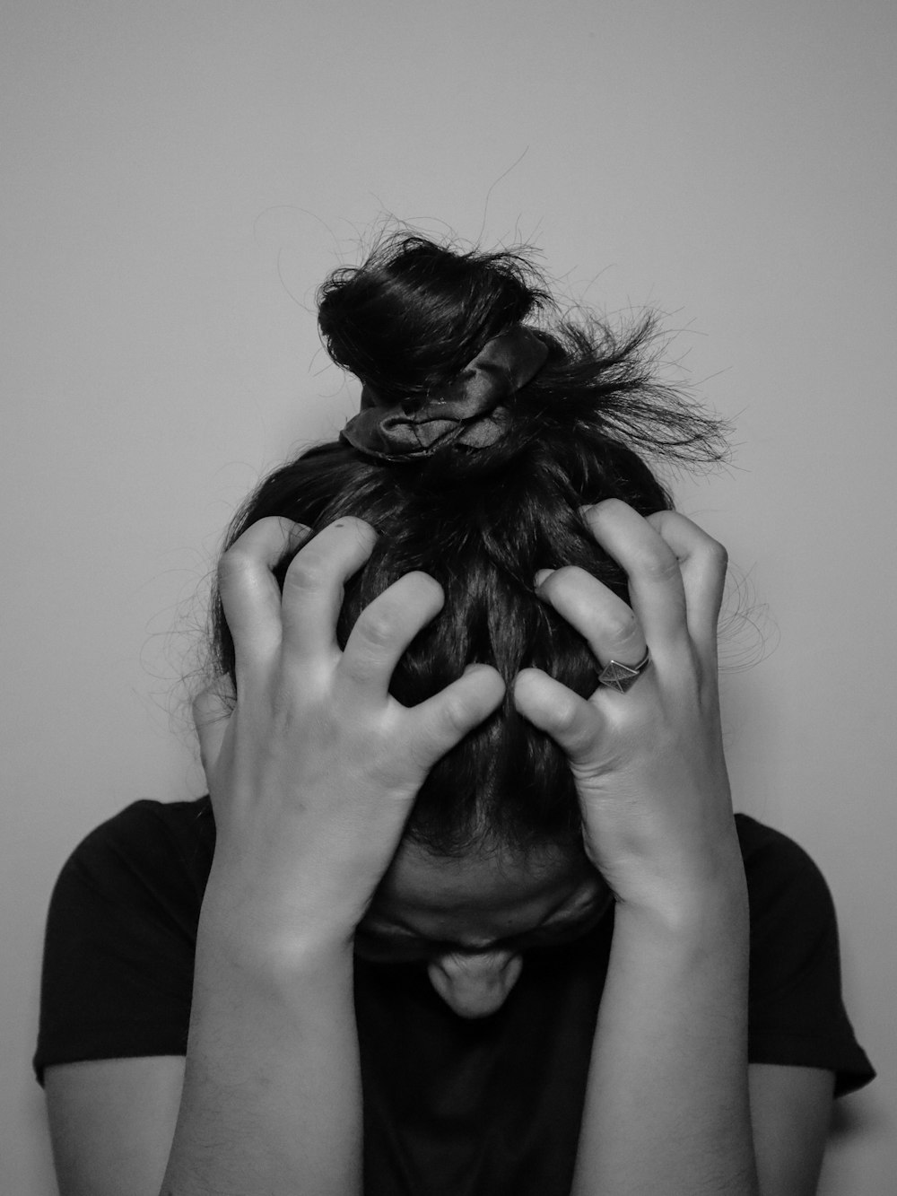 a woman covering her face with her hands