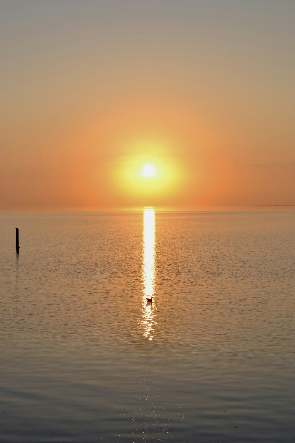 a sunset over a body of water