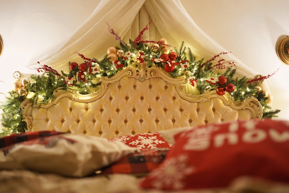 a bed with a canopy and christmas decorations on top of it