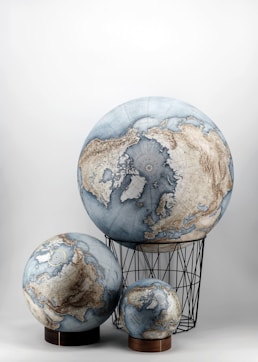 a group of three globes sitting on top of each other