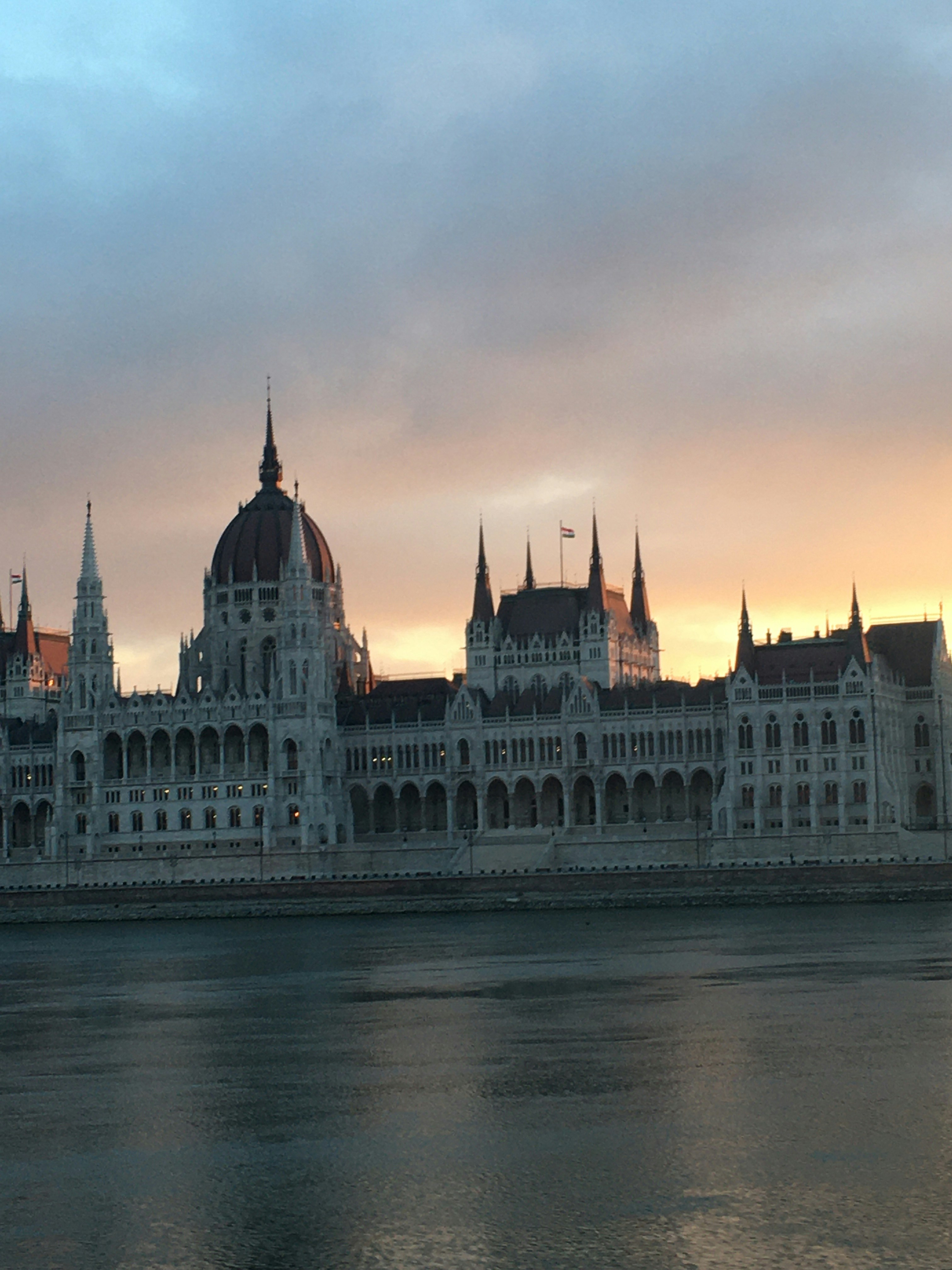Parliament building at sunset, governmental architecture, warm light, civic institution