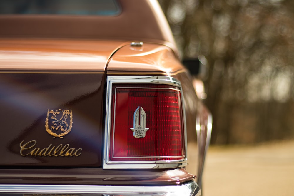 the tail light of a car with a coat of arms on it