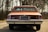 a brown car parked on the side of the road