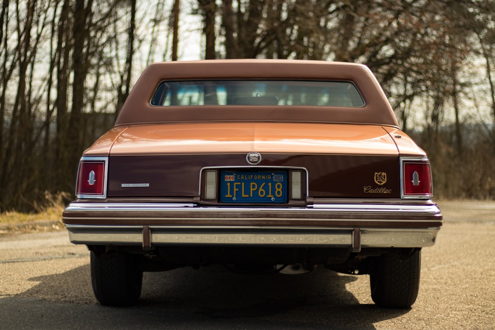 a brown car parked on the side of the road