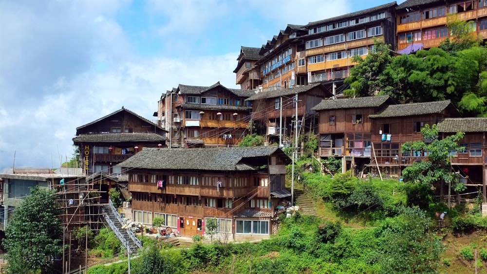 a row of wooden buildings on a hillside