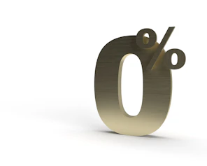 the number zero is shown in gold on a white background