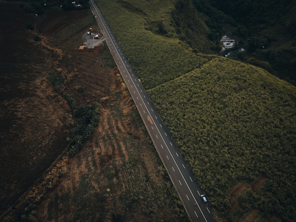 an aerial view of a highway in the country