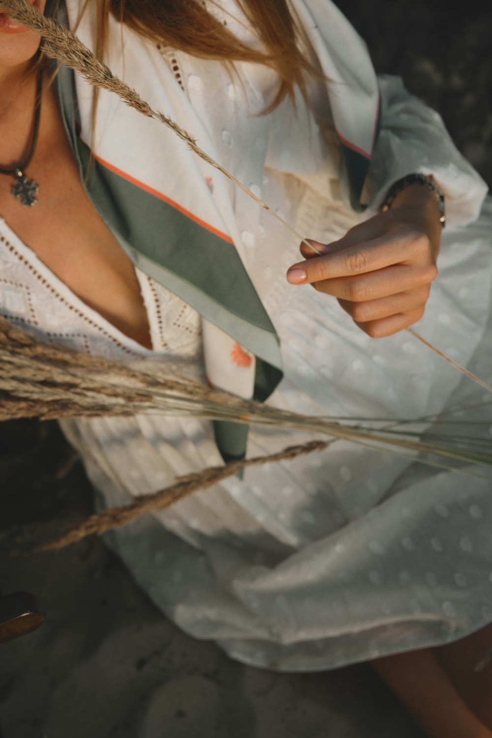 a woman wearing a white shirt and a green tie