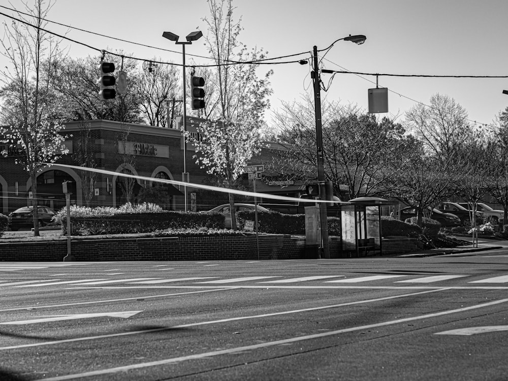 a black and white photo of a street corner