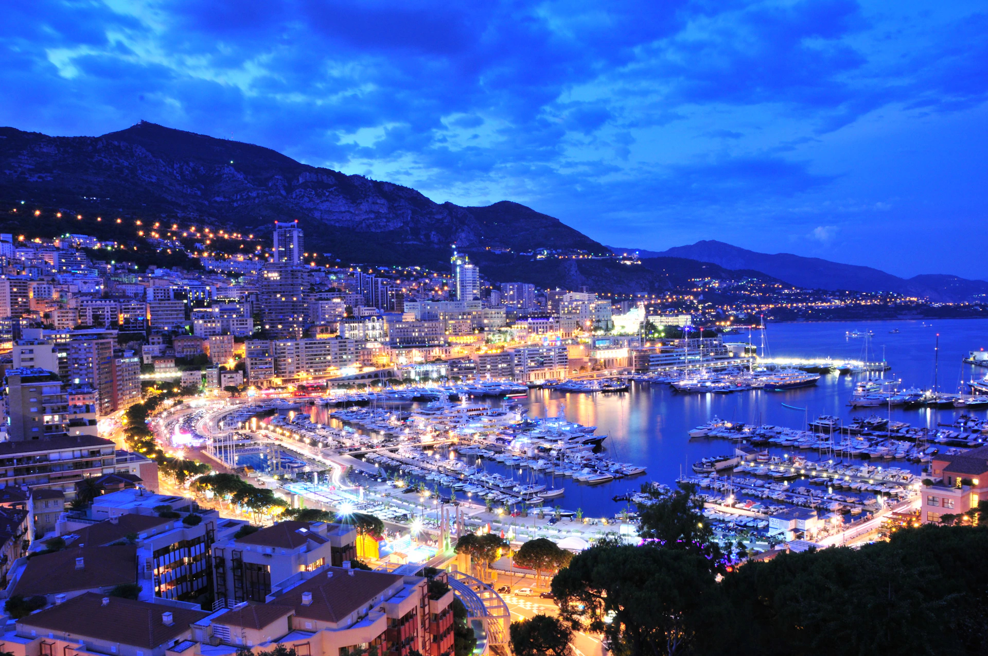 a harbor filled with lots of boats at night