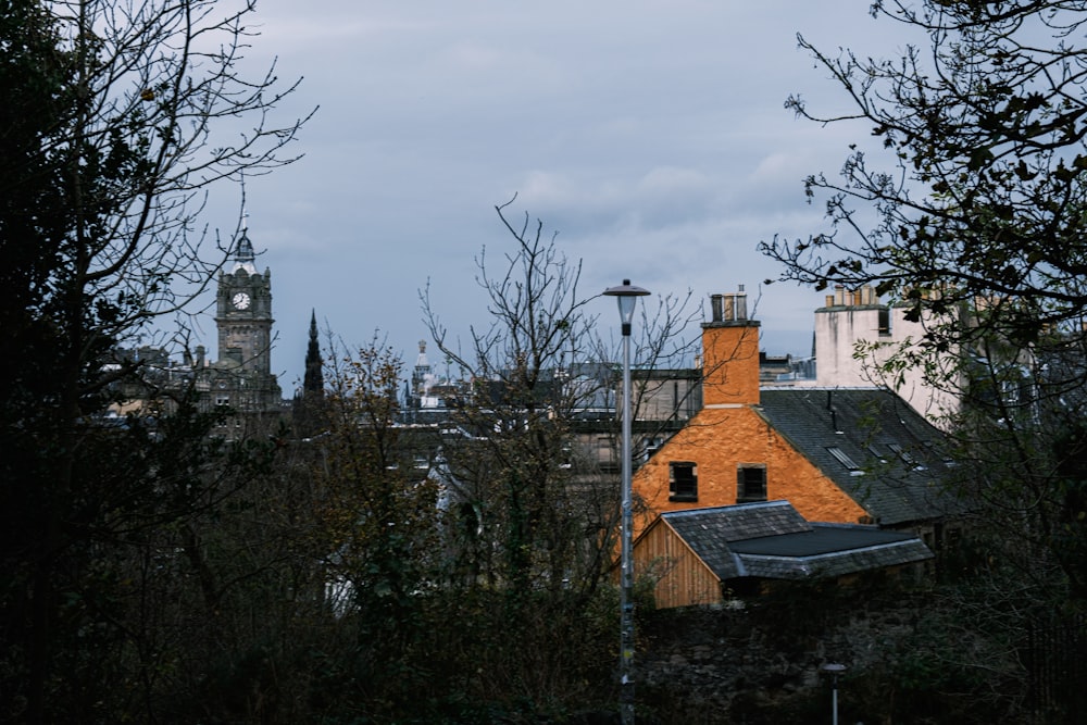 a view of a building with a clock tower in the background