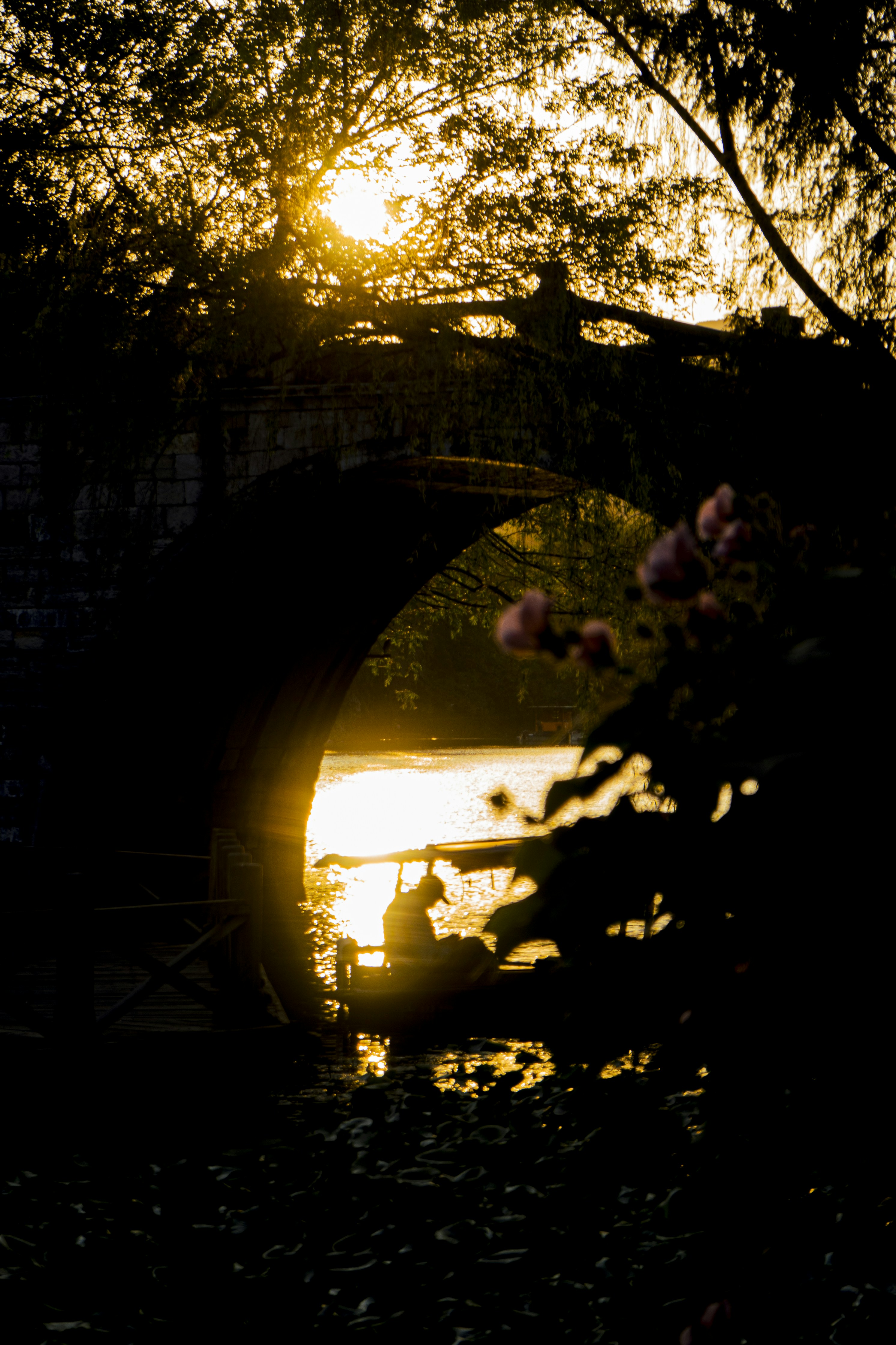 the sun is setting over a body of water