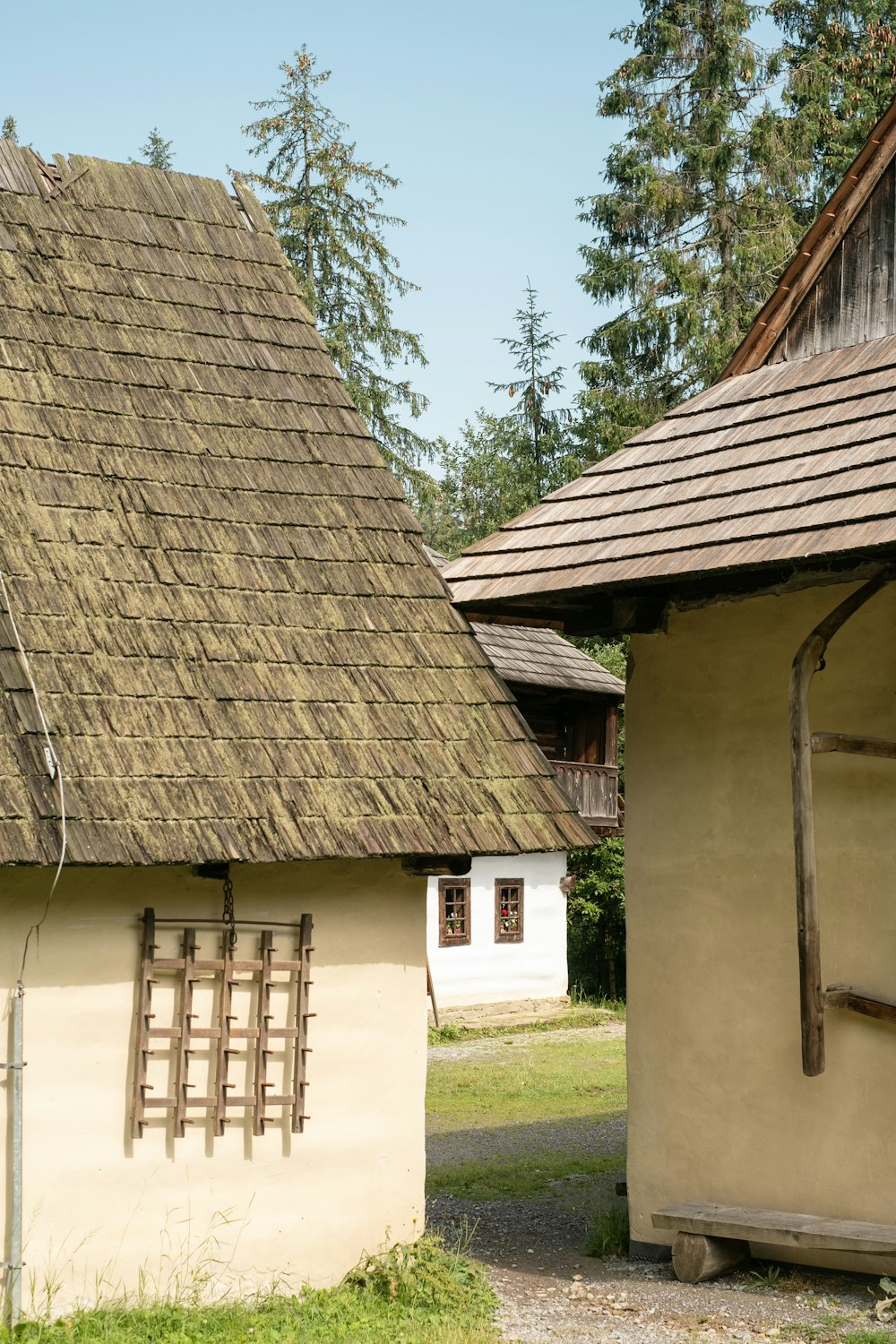 a building with a thatched roof next to another building