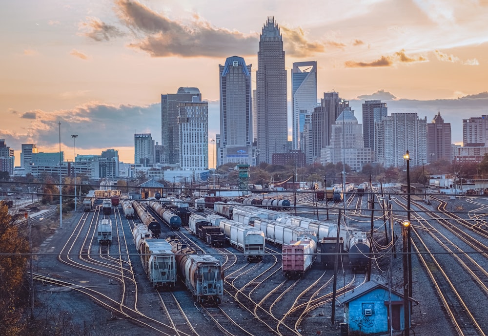 a train yard with many trains on the tracks