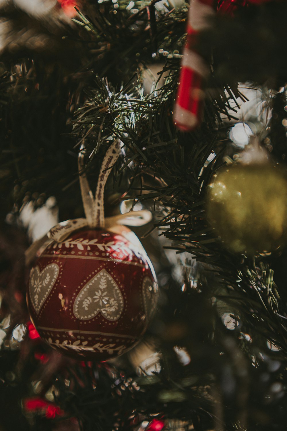 a christmas ornament hanging from a christmas tree