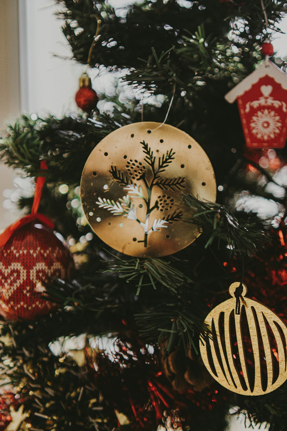 a christmas tree with ornaments hanging from it