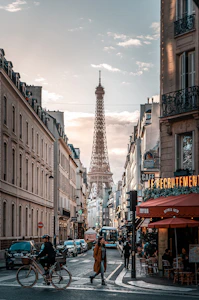 A charming Paris street scene with tourists enjoying a guided city tour on a sunny day.