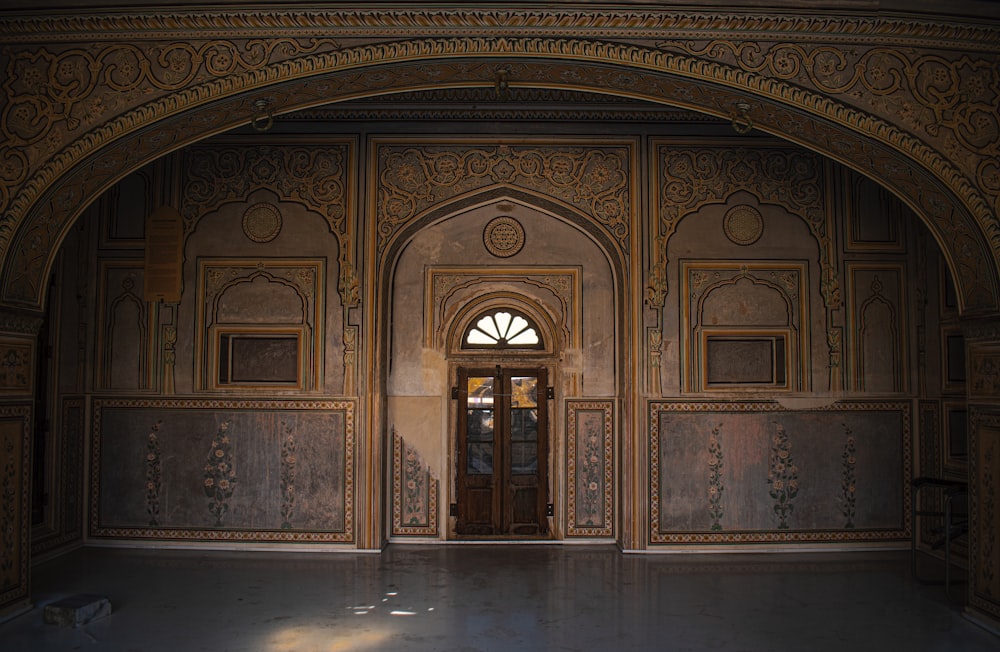 a doorway in a building with a clock on the wall