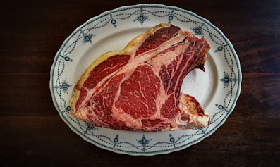 a piece of meat on a plate on a table