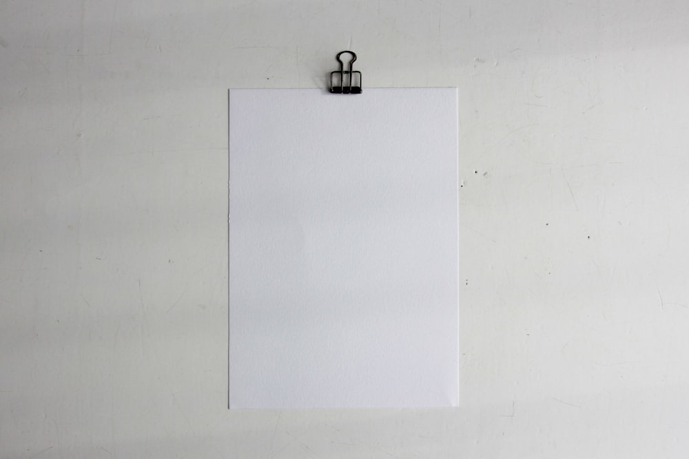 a white piece of paper hanging on a wall