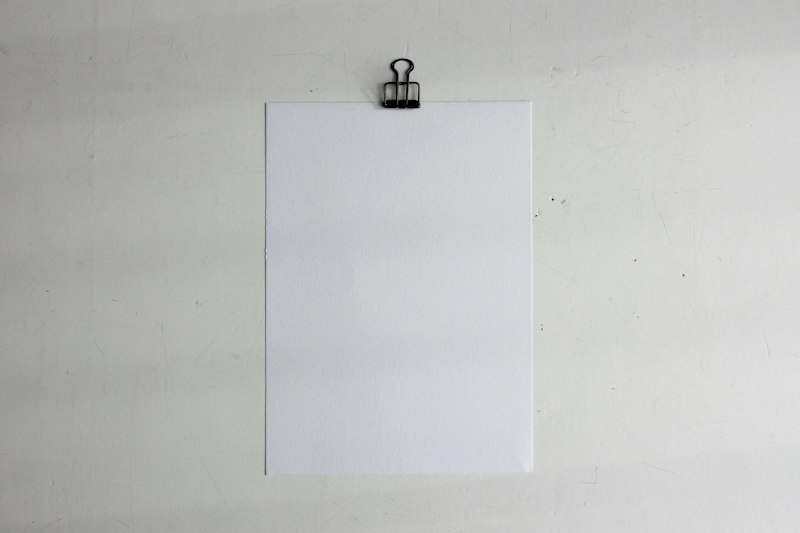 Blank memo sheet held on a clipboard