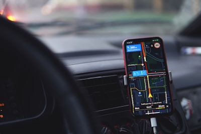 a cell phone is hooked up to a car charger