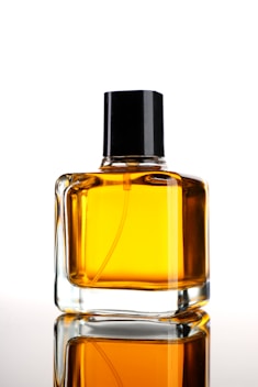 a bottle of perfume sitting on top of a table