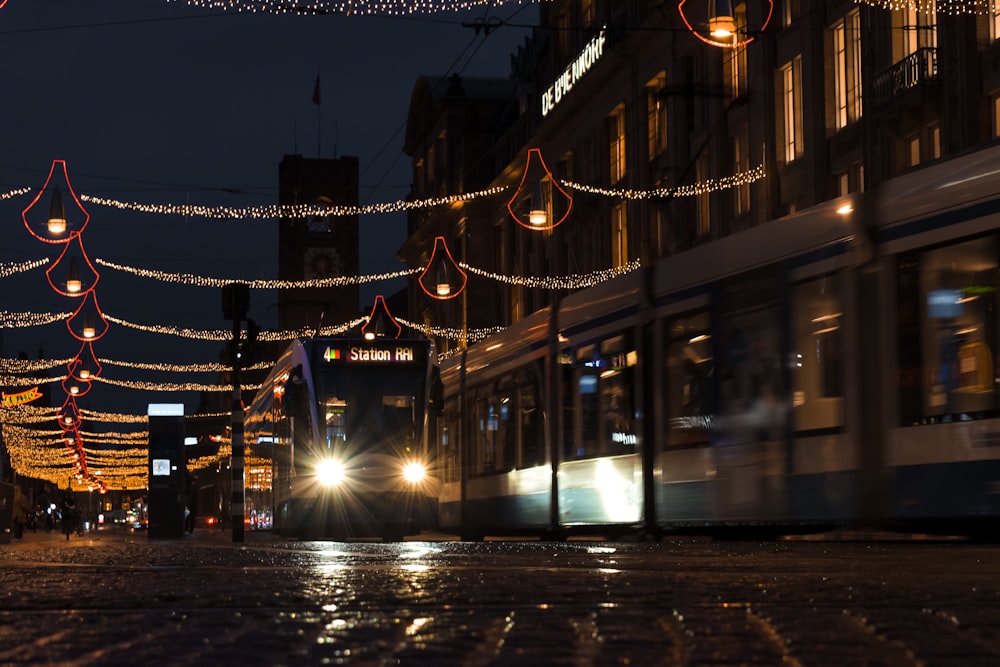 a city street at night with christmas lights