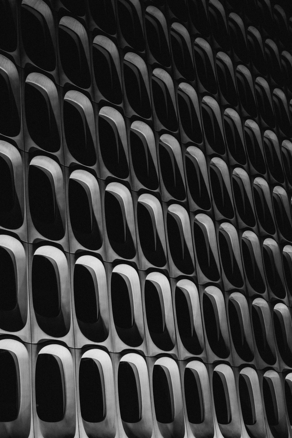 a black and white photo of a wall made up of square and rectangle shapes