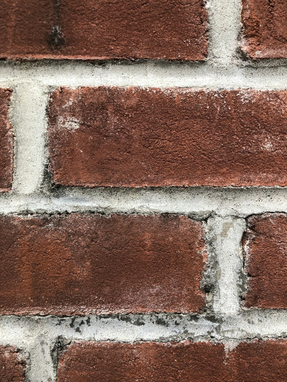 a close up of a red brick wall