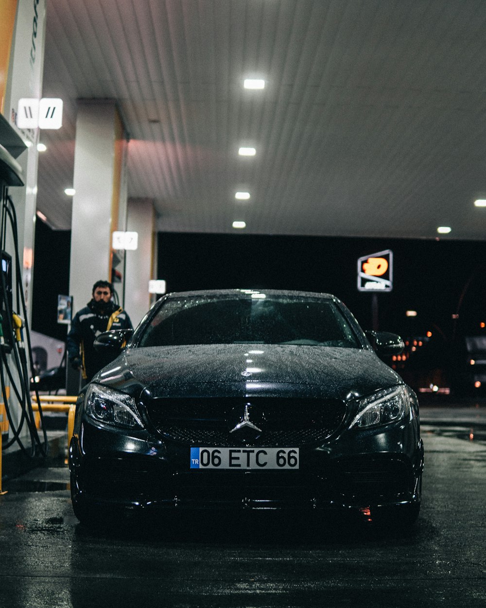 a car is parked in a gas station