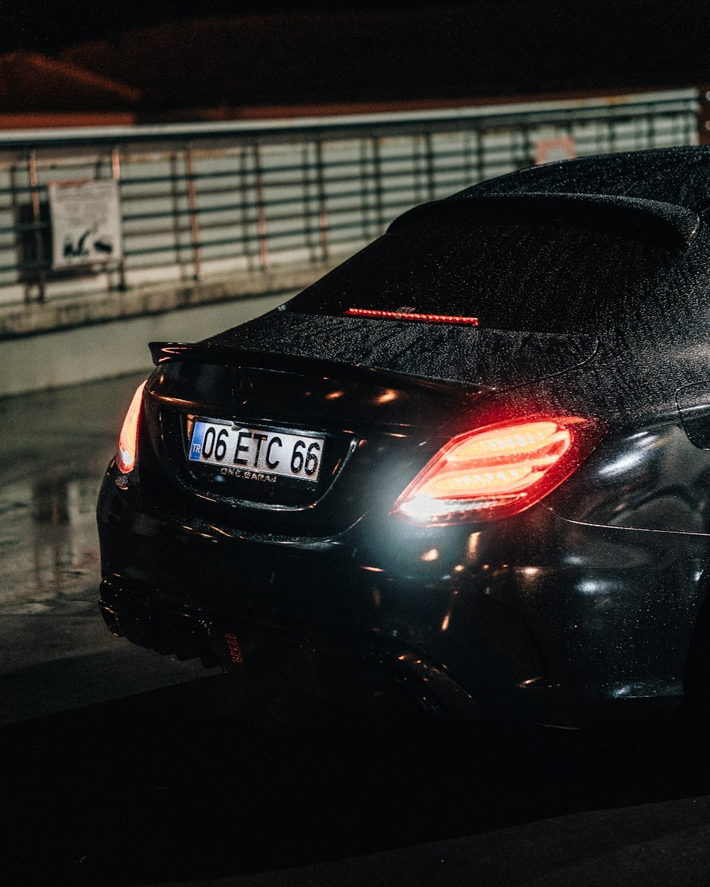 a black car parked on the side of the road