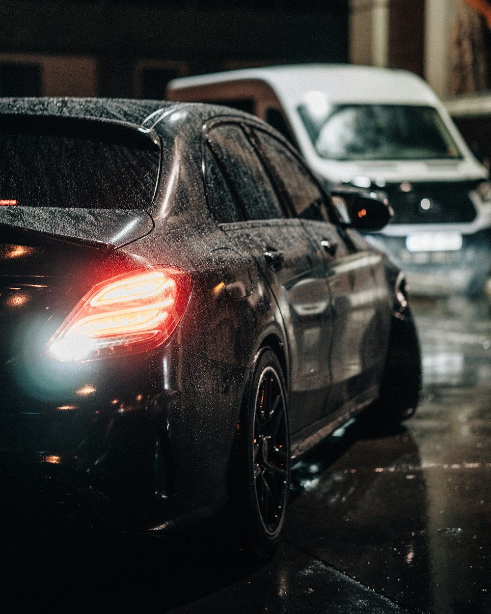 a black car parked in a parking garage