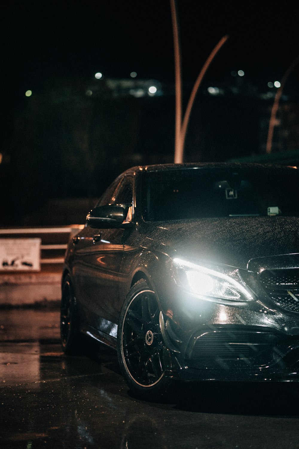 a car parked in a parking lot at night